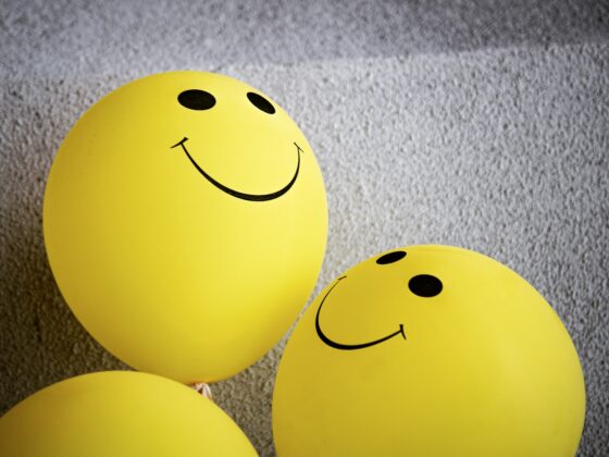 yellow smiley emoji on gray textile