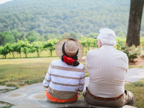 couple sitting on pathway