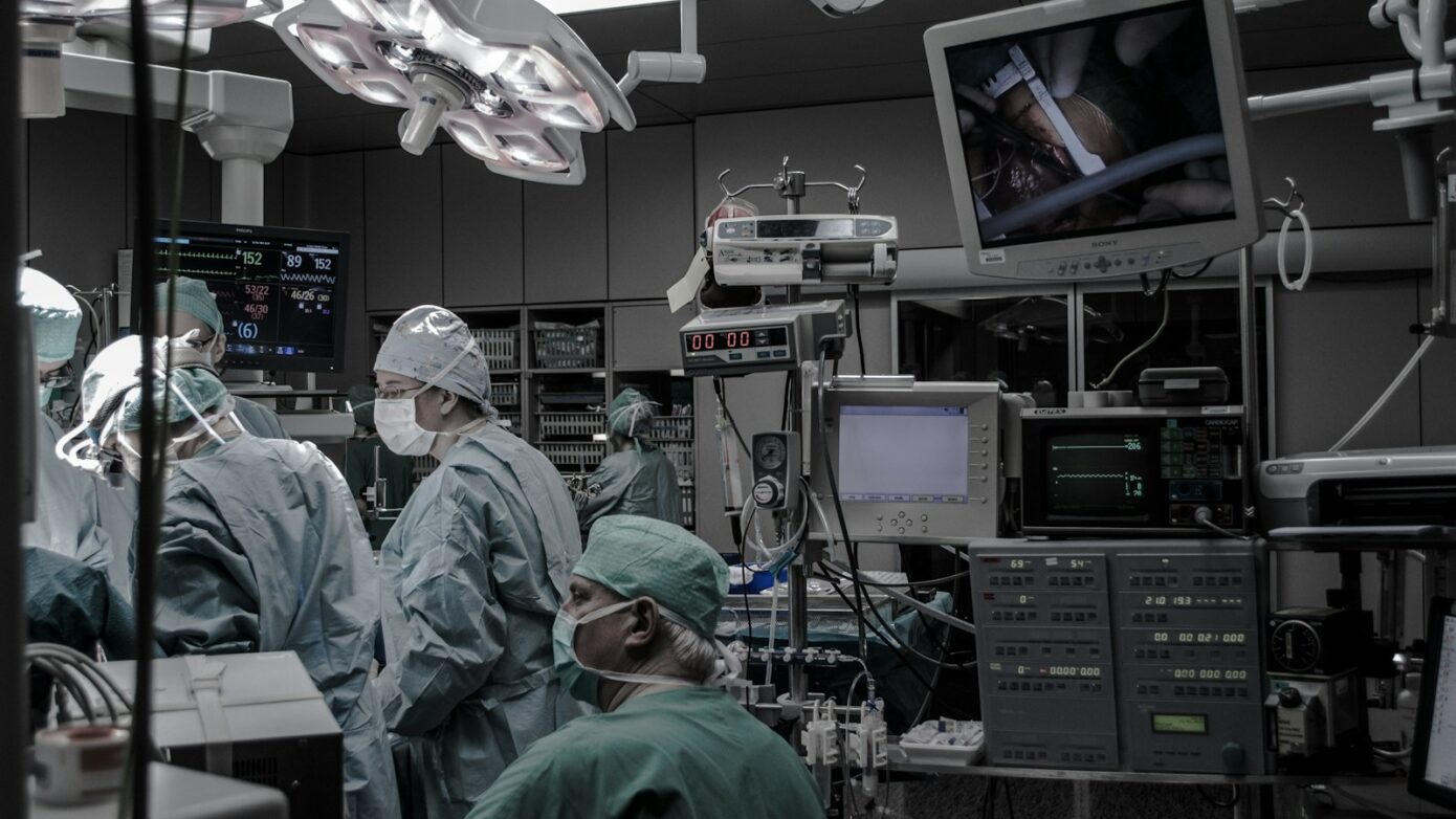 people wearing surgical clothes inside operating room