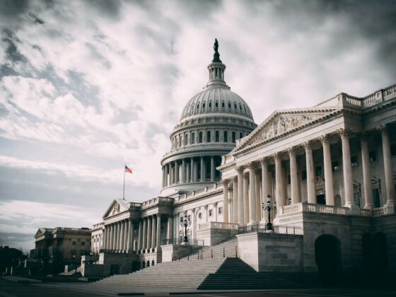 white concrete building under cloudy sky during daytime
